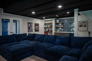 Living room - large open concept carpeted and exposed beam living room idea in Detroit with a bar and a wall-mounted tv
