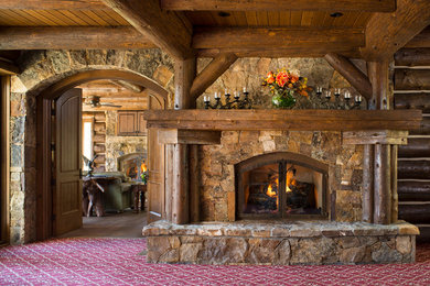 Example of a mountain style home design design in Denver