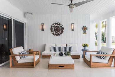 Patio - coastal patio idea in Miami with a roof extension