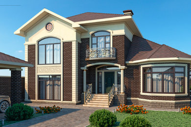 Пример оригинального дизайна: двухэтажный, серый частный загородный дом среднего размера с комбинированной облицовкой, вальмовой крышей и крышей из гибкой черепицы
