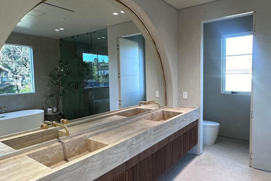 Example of a trendy gray tile single-sink bathroom design in Los Angeles with a bidet, brown countertops and a floating vanity