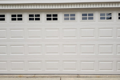 New C.H.I. garage door #2283 with Almond finish and windows Stockton inserts