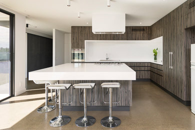 Photo of a contemporary l-shaped kitchen in Melbourne with flat-panel cabinets, grey cabinets, white splashback, panelled appliances and with island.