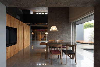 This is an example of an asian dining room in Osaka with grey floor.