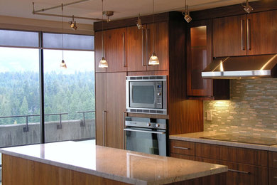 Inspiration for a small modern open plan kitchen in Vancouver with brown cabinets and with island.