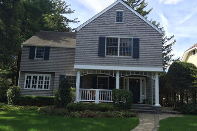 Large coastal beige three-story wood exterior home idea in New York with a shingle roof