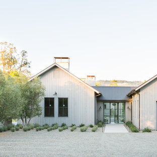 Farmhouse white one-story exterior home idea in San Francisco with a metal roof