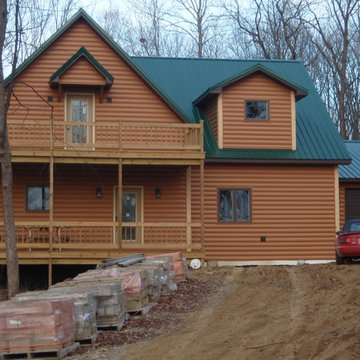 Log cabin built with vinyl siding
