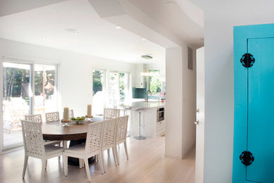 Beach style light wood floor dining room photo in New York