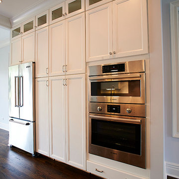 Modern Kitchen with Stainless Steel Appliances and Tall White Cabinetry