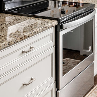 Mid-sized transitional kitchen pantry photos - Mid-sized transitional galley medium tone wood floor and brown floor kitchen pantry photo in Baltimore with an undermount sink, recessed-panel cabinets, white cabinets, granite countertops, multicolored backsplash, cement tile backsplash, stainless steel appliances, no island and multicolored countertops