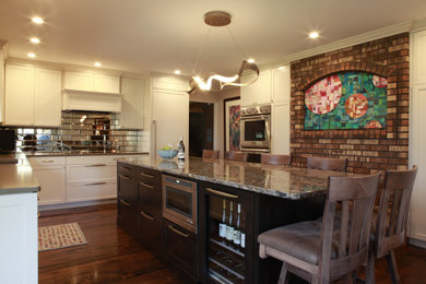 Photo of a mid-sized eclectic separate kitchen with an undermount sink, recessed-panel cabinets, white cabinets, quartz benchtops, glass tile splashback, stainless steel appliances, dark hardwood floors, with island and multi-coloured benchtop.