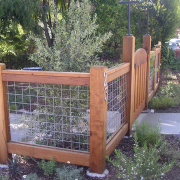 newly planted garden around hogwire fence