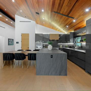 Stone Waterfall Island and Full-Height Panelled Fridge