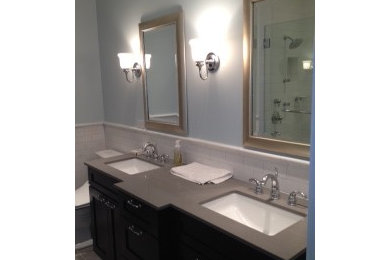 Alcove shower - mid-sized traditional 3/4 white tile and ceramic tile porcelain tile alcove shower idea in Chicago with recessed-panel cabinets, dark wood cabinets, gray walls, an undermount sink and quartz countertops