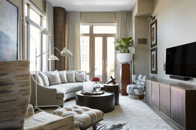 This is an example of a mid-sized contemporary open concept living room in New York with grey walls, light hardwood floors, no fireplace, a wall-mounted tv and grey floor.