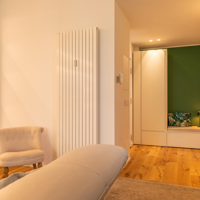 Foyer - small contemporary light wood floor foyer idea in Turin