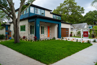 Minimalist two-story brick house exterior photo in Tampa
