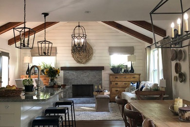 Inspiration for a mid-sized country dark wood floor and brown floor kitchen/dining room combo remodel in Atlanta with beige walls and no fireplace