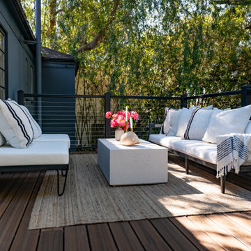 Celebritity IOU backyard deck featuring Spiced Teak composite decking with A310