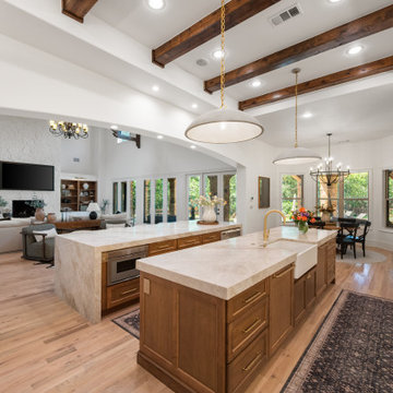 Open-Concept Great Room with White Stone Fireplace and Seamless Kitchen-to-Livin