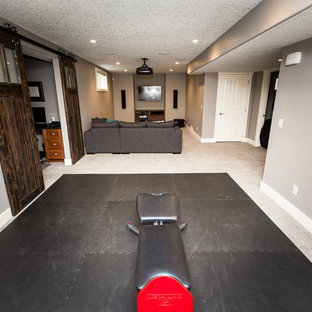Small traditional open plan home cinema in Calgary with grey walls, carpet and a projector screen.