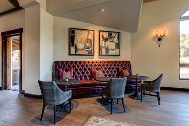 Inspiration for a large mediterranean light wood floor wine cellar remodel in Los Angeles