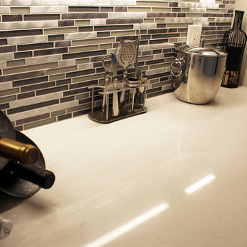 White Kitchen with Gray and Black Quartz Countertop and Bar Area ~ Streetsboro