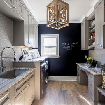 Customized Laundry/Mud Room with Desk, Utility Sink, and Storage Solutions