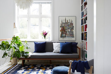 Photo of a mid-sized modern living room in Copenhagen with white walls and no tv.