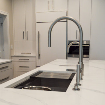 Transitional White Kitchen with Large Island and Dining Room