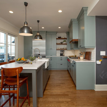 Warm Open Kitchen with Blue/Gray/Green Cabinets and Dark Wood