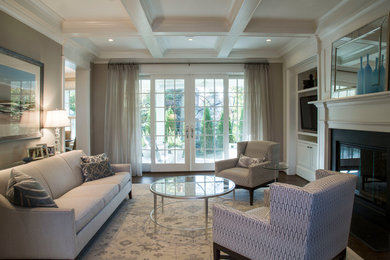 Living room - mid-sized transitional open concept dark wood floor living room idea in DC Metro with gray walls, a standard fireplace, a media wall and a stone fireplace