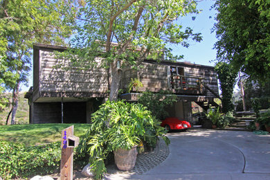 Mountain style wood exterior home photo in Orange County