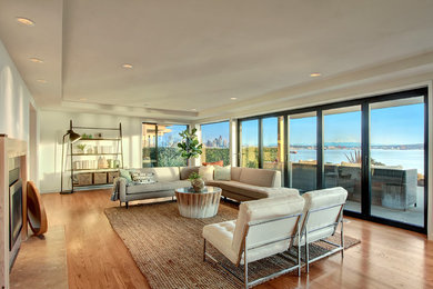 Living room - mid-sized contemporary formal and open concept light wood floor living room idea in Seattle with white walls
