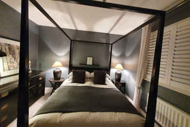 This is an example of a contemporary bedroom in Sussex.