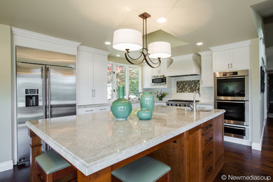 Example of a classic l-shaped eat-in kitchen design in Other with shaker cabinets, white cabinets, granite countertops, white backsplash and subway tile backsplash