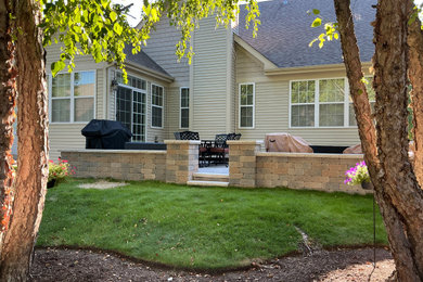 Transitional stone patio photo in Chicago