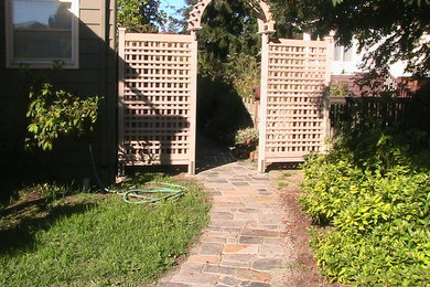 Design ideas for a mid-sized contemporary side yard stone garden path in Seattle.