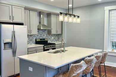Trendy medium tone wood floor kitchen photo in Richmond with ceramic backsplash