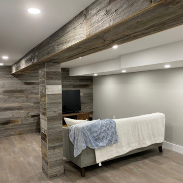 Basement renovation with reclaimed barn wood feature