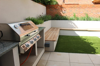 This is an example of a small mediterranean courtyard partial sun garden in Hampshire.