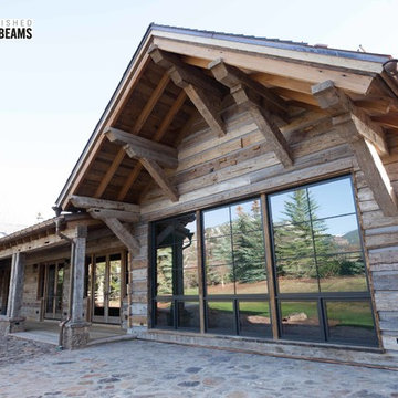Hand Hewn Hammer Beams and Slab Siding with Oak Flooring