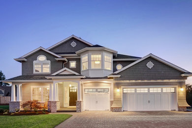Large transitional gray two-story concrete fiberboard gable roof idea in New York
