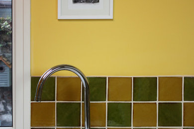 Farmhouse kitchen in Other with ceramic splashback.