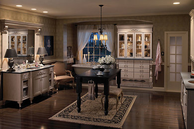 Bathroom - mid-sized traditional master gray tile dark wood floor and gray floor bathroom idea in New York with white cabinets, a one-piece toilet, gray walls, a drop-in sink and solid surface countertops