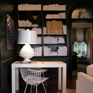 Design ideas for a medium sized modern study in New York with black walls, dark hardwood flooring, no fireplace, a freestanding desk and brown floors.