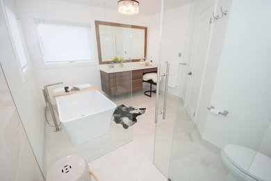Example of a large trendy master white tile and porcelain tile porcelain tile and white floor bathroom design in Toronto with flat-panel cabinets, medium tone wood cabinets, a one-piece toilet, white walls, an undermount sink, quartz countertops and white countertops