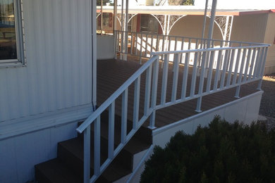 Elegant deck photo in Phoenix with a roof extension