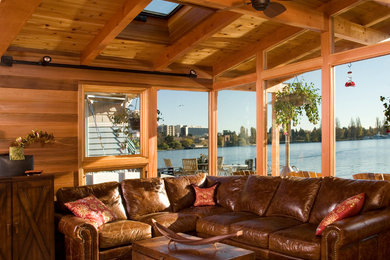 Family room - large transitional open concept medium tone wood floor family room idea in Seattle with a wall-mounted tv